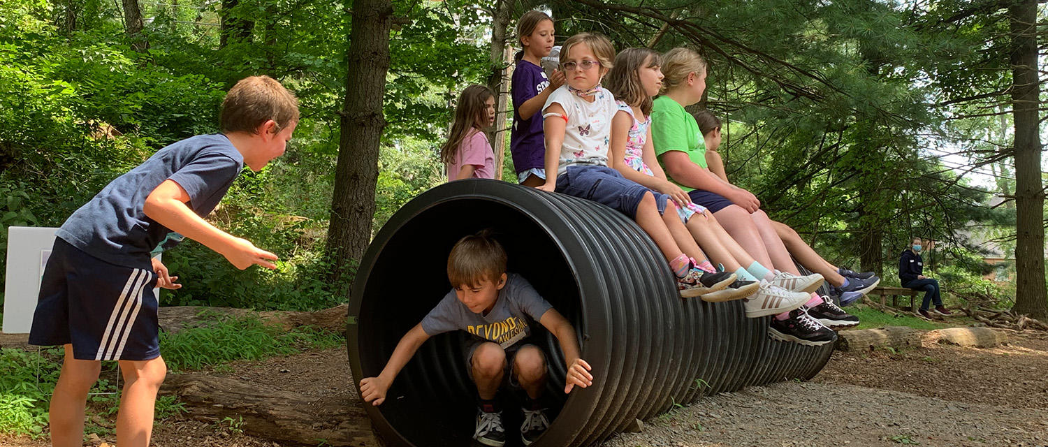 climbing through tube