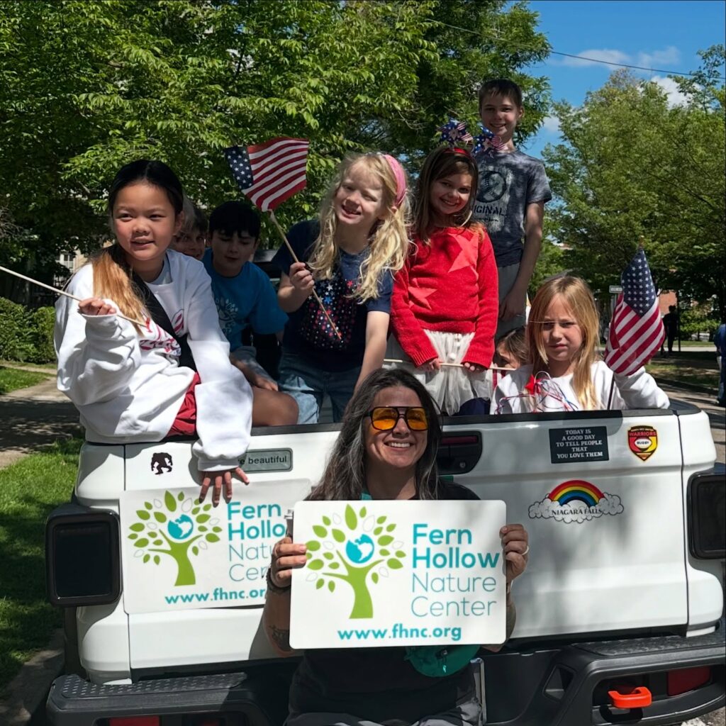 Kids waiving flags + FHNC sign