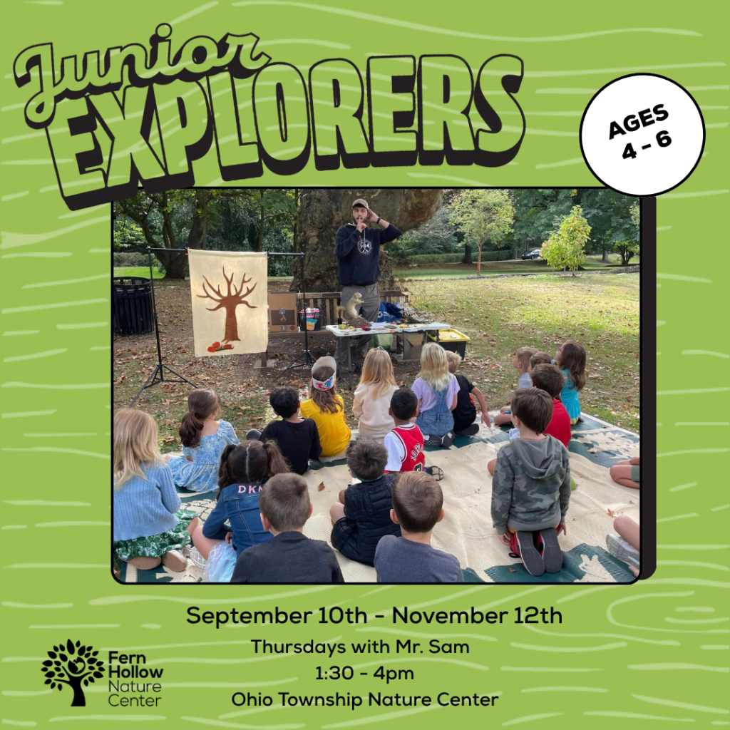 Poster for Junior Explorers: kids sit on a blanket outdoors while a presenter talks with a tree banner and props; Fern Hollow Nature Center logo visible.